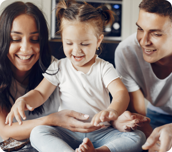 A couple playing with their kid